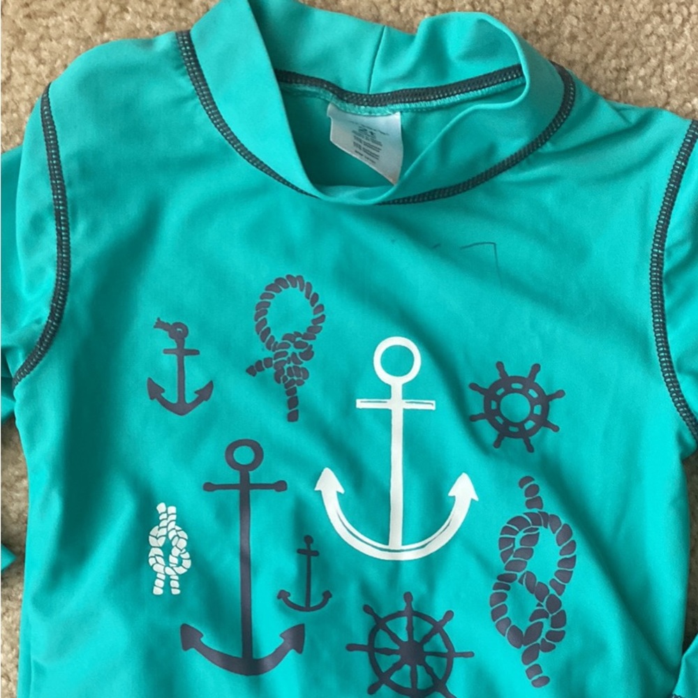 Size 2T Carters brand swim trunks and long sleeve rash guard